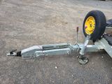 a trailer with a flat tire attached to it