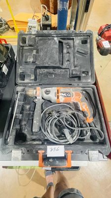 a man holding a tool box with tools in it