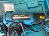 a blue tool that is sitting on top of a blue case
