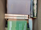 a box full of books that are sitting on the floor