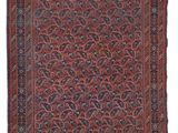 un tapis rouge avec un motif floral sur fond blanc