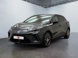 a grey toyota c - hr is parked in a large room