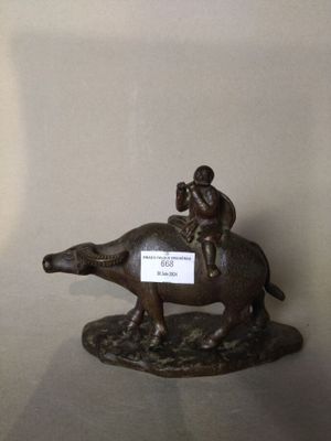 "Enfant musicien sur un buffle".