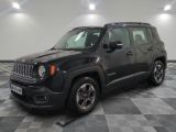 the black jeep is parked in the garage on a checkered floor