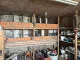 a room with a lot of shelves and a lot of items