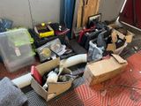 a pile of boxes and other items on the floor