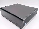 an image of a small black computer on a white surface