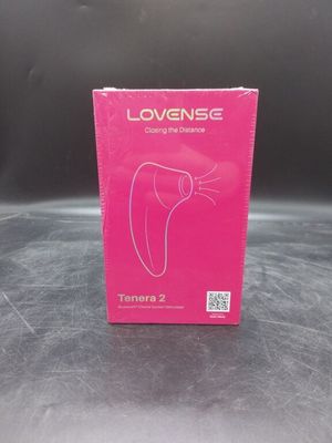 the box of a pink blow dryer sitting on top of a table