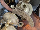 many different types of brass items in this box