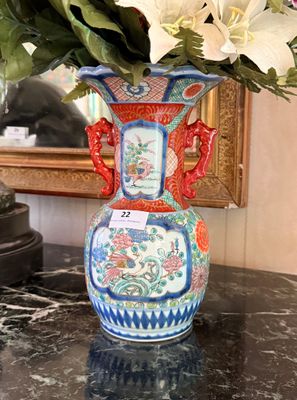 a vase with flowers in it sitting on a table