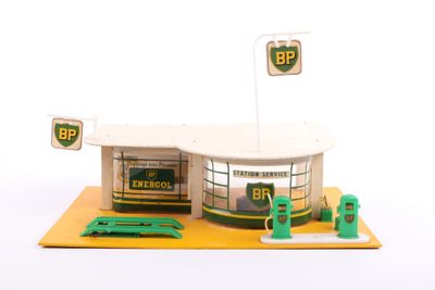 a small model of a gas station with a gas pump