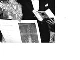 black and white photograph of a man and a woman standing next to each other