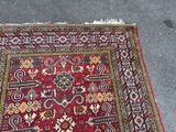 an image of a red rug on the ground
