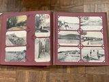 an open book with pictures of people on it on a table