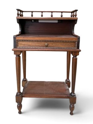 an old wooden desk with a drawer on top of it