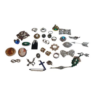 many different types of jewelry on a white surface