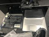 two laptops that are sitting on the floor