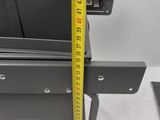 a measuring tape on the side of a metal box