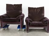 two chairs that are sitting next to each other