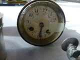 an old clock that is sitting on a table