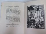 an open book with a picture of a woman sitting on a chair