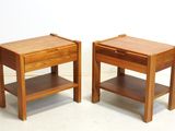 two wooden tables with a drawer on each of them