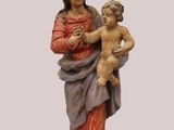 an image of a statue of a woman holding a child