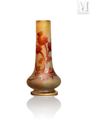 a vase with a painting on it sitting on a white surface