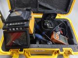 a yellow case that has a camera and other items in it
