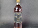a bottle of wine that is sitting on a table