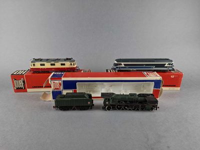 three toy trains sitting next to each other on a table
