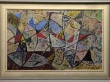 painting of abstract shapes and colors in a frame on a wall