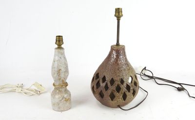 two lamps sitting next to each other on a white surface