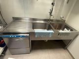 a stainless steel sink and a dishwasher in a kitchen