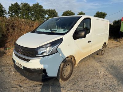a white van that is parked on the side of the road