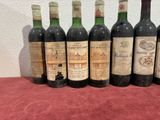 several bottles of wine are lined up on a table