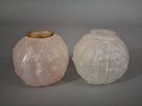 two white vases sitting next to each other on a table