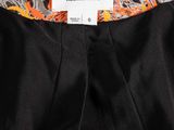a label on the back of a dress that says helmut lang
