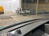 a view from inside of a car of a parking lot