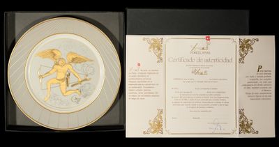a plate with a picture of a cupid on it