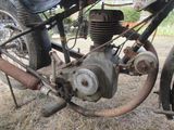 a close up of a motorcycle engine on the ground