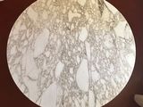 a round marble table top on a brown table