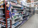 a lot of shelves in a store with various items on them