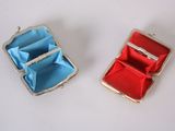 pair of red and blue jewelry boxes on white surface