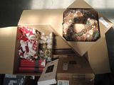 a box with a wreath inside of it on the floor