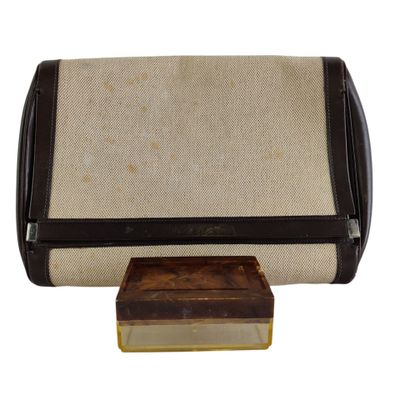 an image of a brown and white purse with a small box