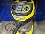 a yellow and black vacuum on the floor