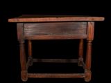 a small wooden table with a drawer on it