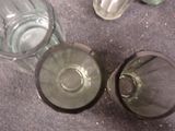 two empty glass bottles sitting on a table