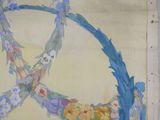 a painting on the wall of a building that has a peace sign painted on it